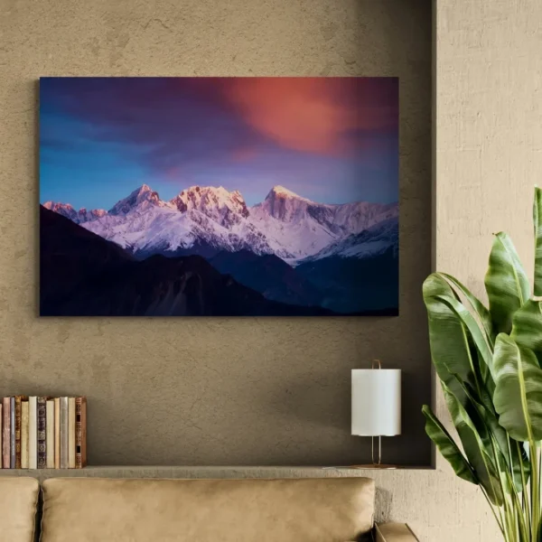 Nature-themed canvas wall art of majestic mountains with snowy peaks, reflecting a serene sunrise against a dramatic pink and blue sky.
