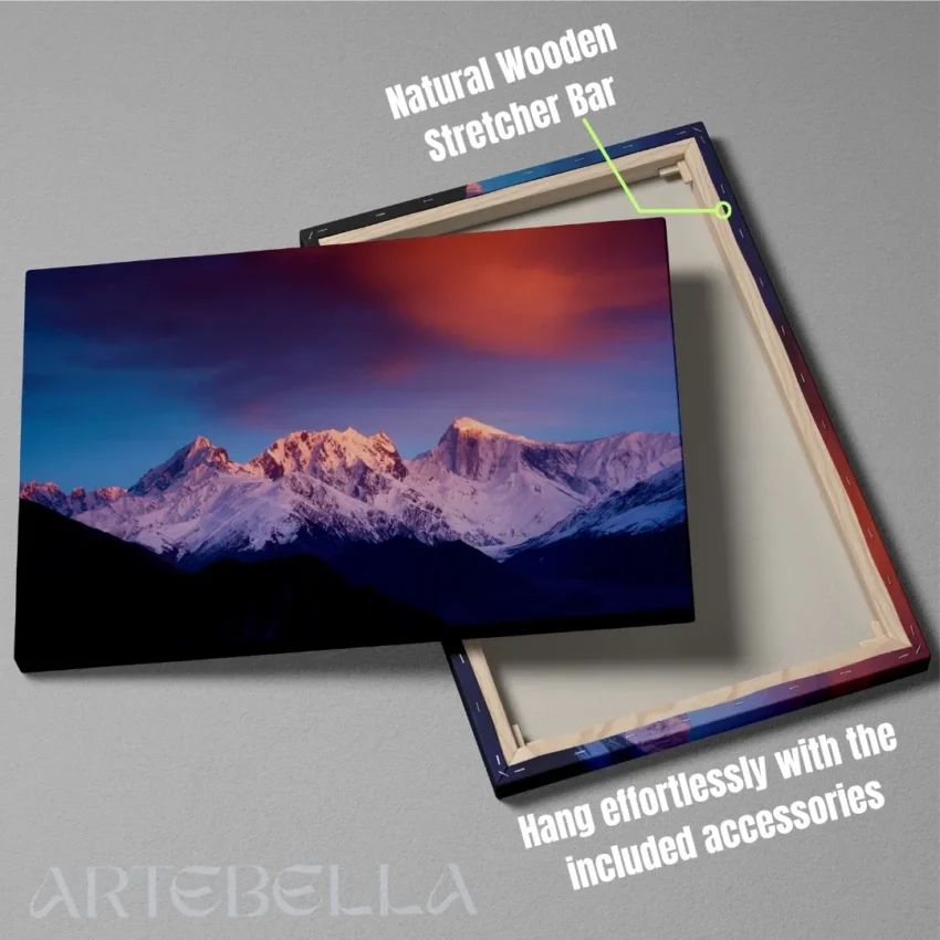 Nature-themed canvas wall art of majestic mountains with snowy peaks, reflecting a serene sunrise against a dramatic pink and blue sky.