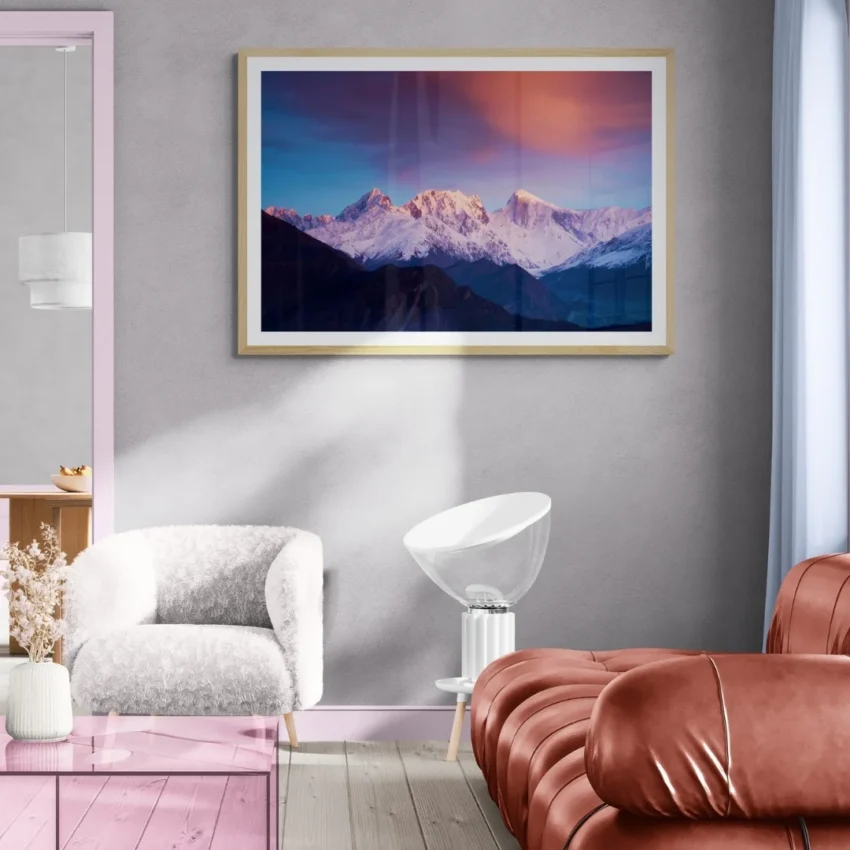 Nature-themed canvas wall art of majestic mountains with snowy peaks, reflecting a serene sunrise against a dramatic pink and blue sky.