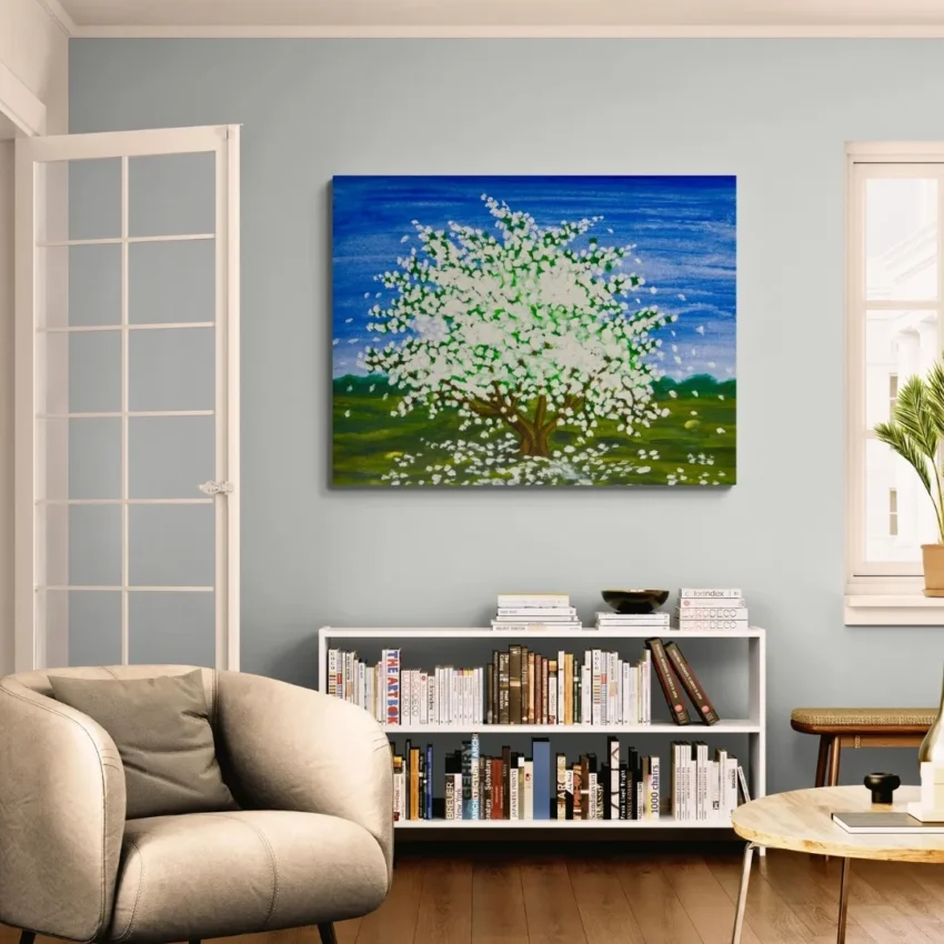 A modern abstract painting titled "Blossoming Beauty" of a vibrant tree in full white blossom against a bright blue sky on a canvas.