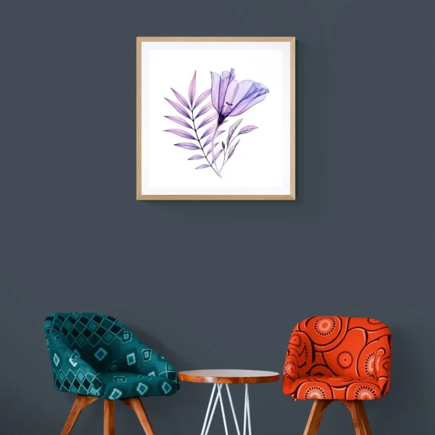 A framed print titled "A Gentle Whisper of Spring" showing a translucent purple flower with delicate leaves on a white background