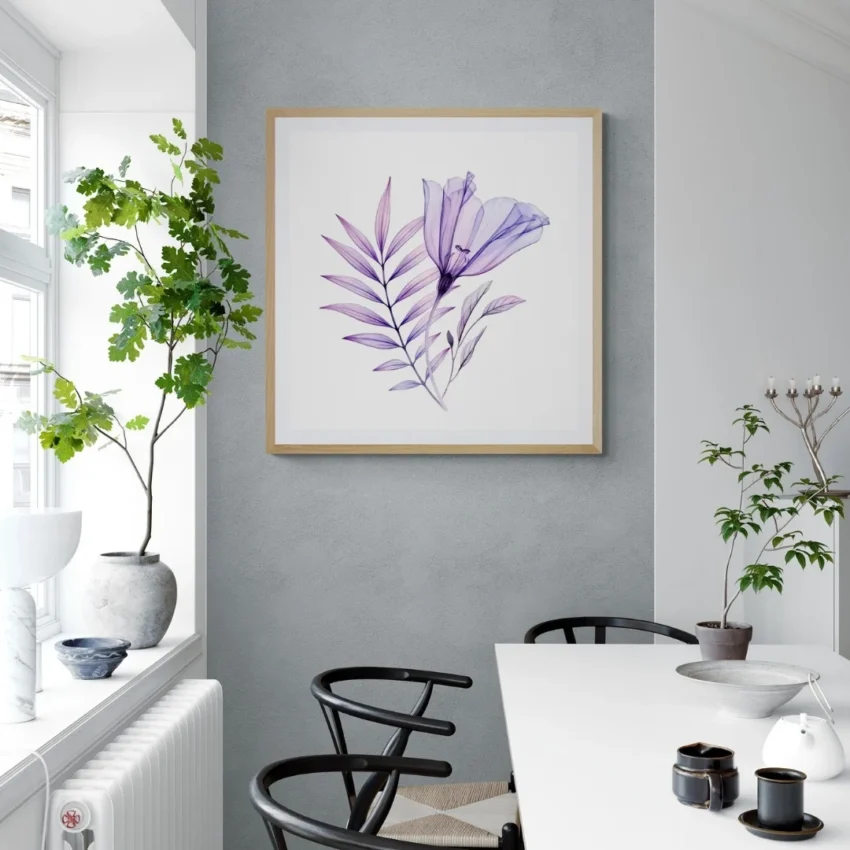 A framed print titled "A Gentle Whisper of Spring" showing a translucent purple flower with delicate leaves on a white background