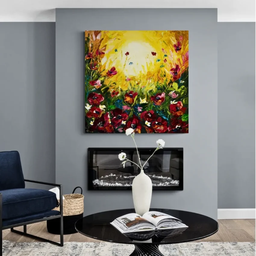 Modern abstract art showing a field of flowers with red poppies and a yellow sun with glowing golden sky, titled "Golden Bliss" and displayed in a living room.