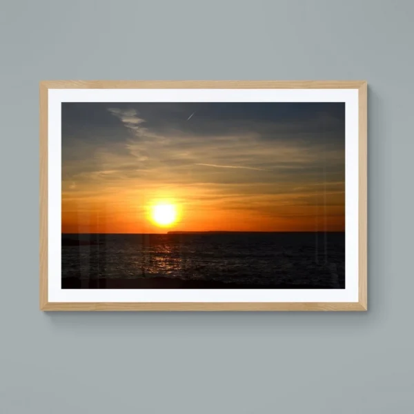 Nature-themed canvas wall art of a painting titled "Golden Serenity" capturing a timeless sunset over the ocean.