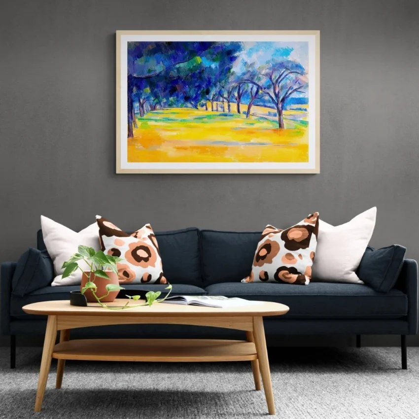 A framed wall art painting titled "Path Through the Golden Woods" showing a scenic path through blue and green trees with bright yellow grass.