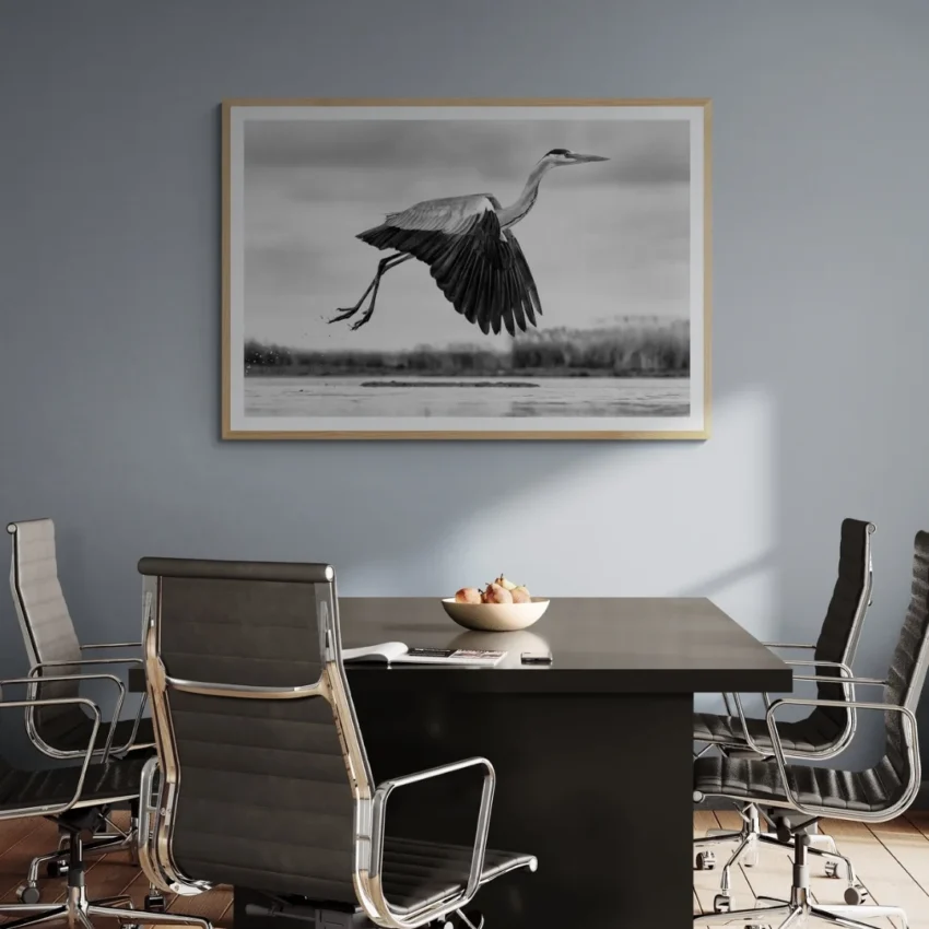 Nature-themed canvas wall art showing a heron with its wings spread in mid-flight over water.