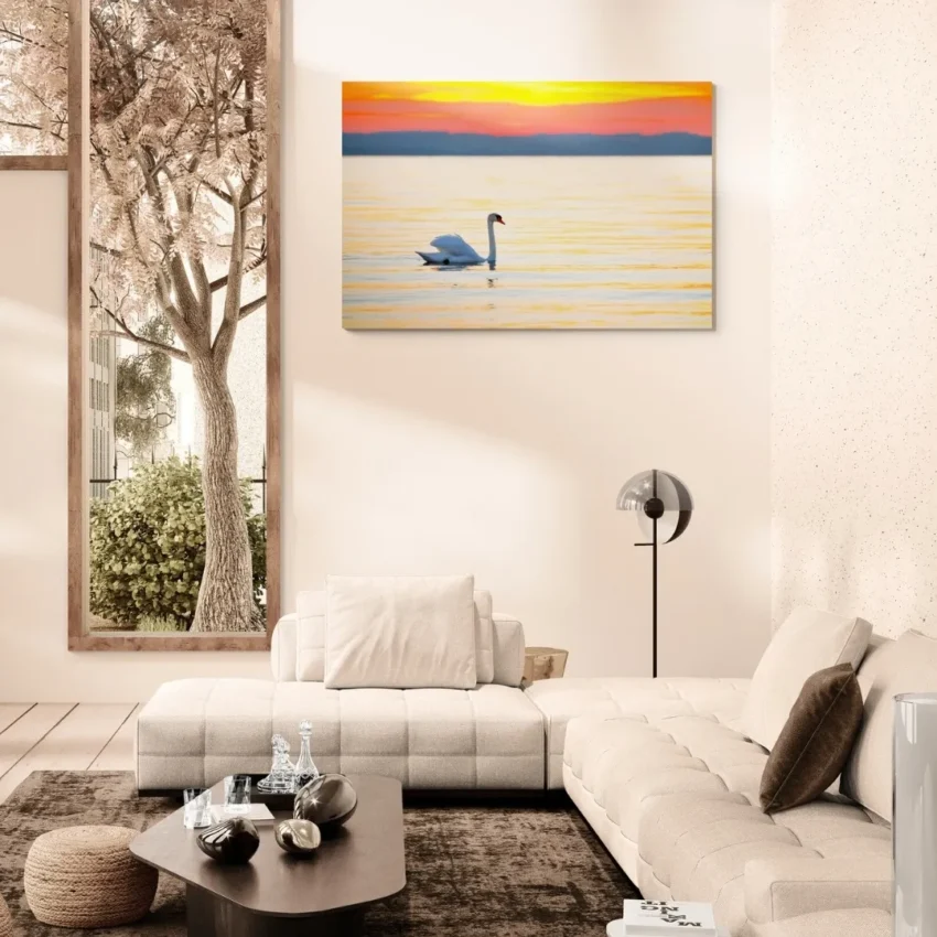 Nature-themed gallery wraps canvas wall art of a serene white swan gliding on calm water during a vibrant orange and gold sunset capturing a peaceful and elegant atmosphere.