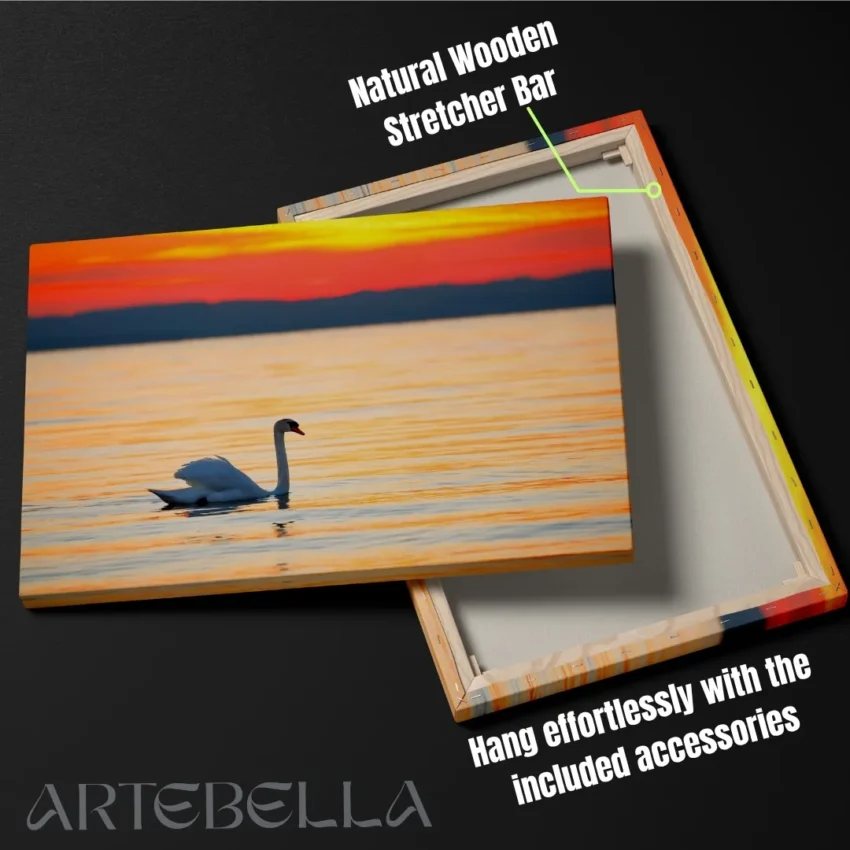 Nature-themed gallery wraps canvas wall art of a serene white swan gliding on calm water during a vibrant orange and gold sunset capturing a peaceful and elegant atmosphere.