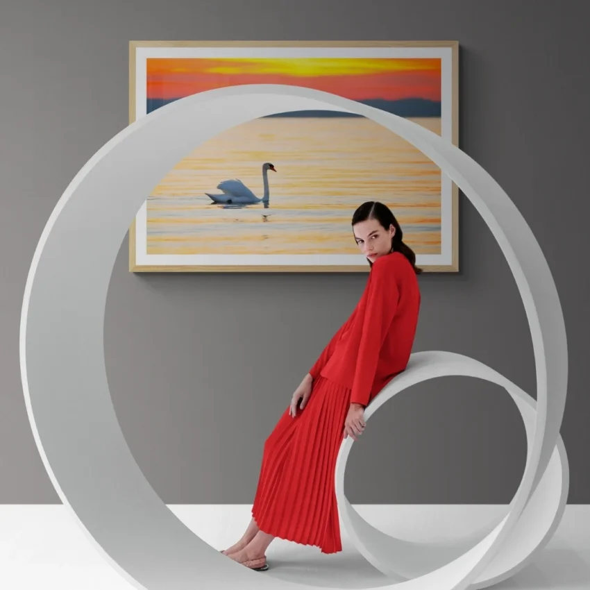 Nature-themed gallery wraps canvas wall art of a serene white swan gliding on calm water during a vibrant orange and gold sunset capturing a peaceful and elegant atmosphere.