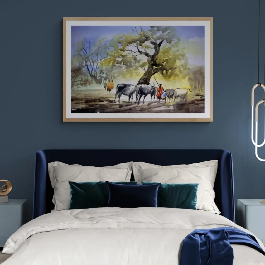A framed painting titled "Rural Serenity" showing cattle and villagers resting under a large banyan tree in a peaceful countryside scene.