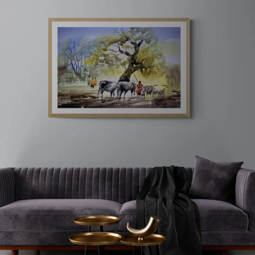 A framed painting titled "Rural Serenity" showing cattle and villagers resting under a large banyan tree in a peaceful countryside scene.