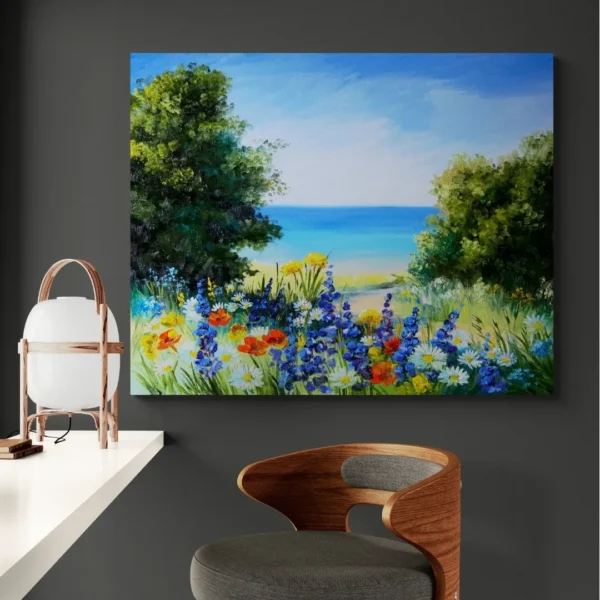 A vibrant painting titled "Tranquil-seascape-with-wild-flowers " showing a field of wildflowers with a path leading to a blue ocean and beach, displayed as nature wall art.