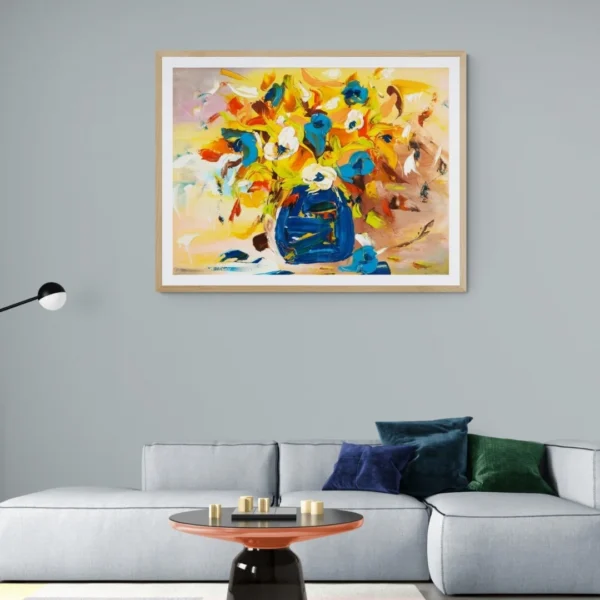 A modern, expressive painting titled "Colourful Harmony" of a vibrant bouquet painting with lively brushstrokes, showing red, orange flowers in a bold blue vase, displayed as framed wall art.